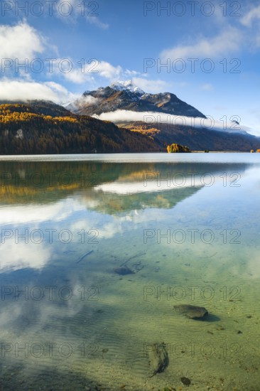 Clouds of fog over Lake Sils with Piz da la Margna in the background, Upper Engadin, Canton of