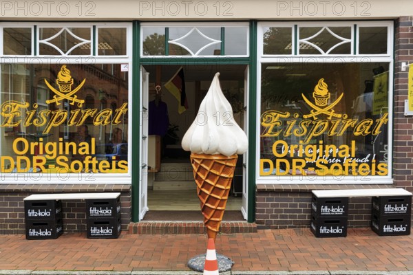 Shop window with inscription original GDR soft ice cream, soft ice cream bag in front of the
