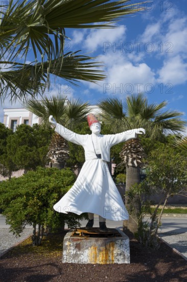 A white sculpture of a dancing man surrounded by palm trees under a clear sky, the swirling