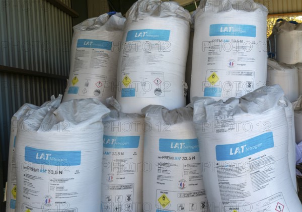 MYPREMIAN ammonium nitrate LAR nitrogen fertiliser bags stored in farm barn, Suffolk, England, UK