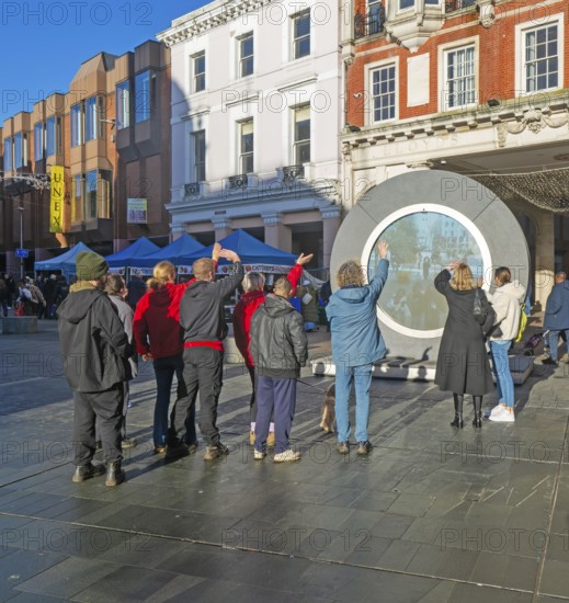 People on the Cornhill in the town centre view the first ever UK Portal in Ipswich, Suffolk,