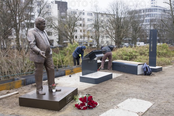 Workers erect the Walter LÃ¼bcke Square in front of the Konrad Adenauer Haus, the party