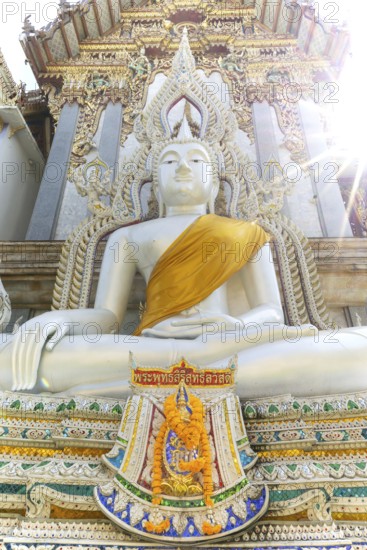 Buddha statue with tunic, Bhumispara mudra, Buddha Gautama at the moment of enlightenment, at the