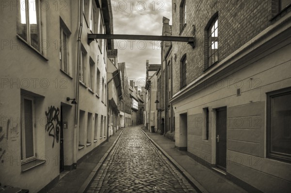 Alley of LÃ¼beck's old town with historic houses, Sepia, Seventh QuerstraÃŸe, Hanseatic City of