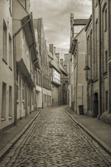 Alley of LÃ¼beck's old town with historic houses, Sepia, Seventh QuerstraÃŸe, Hanseatic City of
