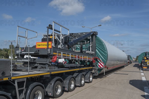 Heavy-duty transporter with a part of a wind turbine, at a motorway rest area of the A9,