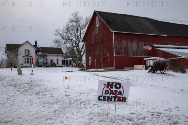 Saline, Michigan USA - 1 December 2025 - A sign on a rural Michigan road opposes a planned $7