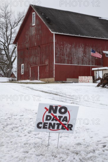Saline, Michigan USA - 1 December 2025 - A sign on a rural Michigan road opposes a planned $7