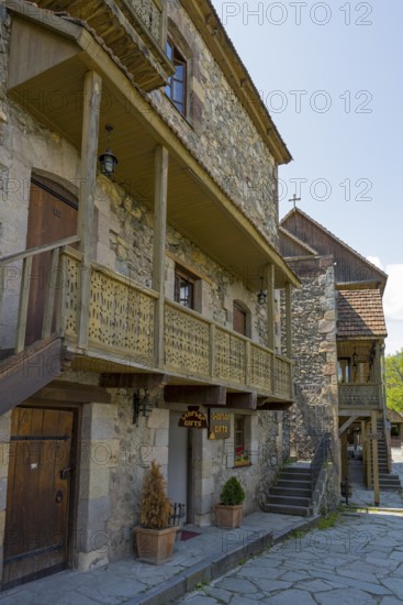 Ancient building with wooden ornaments and outdoor stone steps, Old Town, Sharambeyan Street,