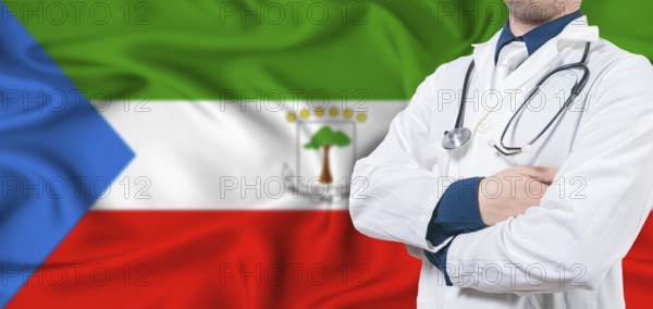 Equatorial Guinea healthcare concept. Male doctor on Equatorial Guinea flag. Doctor with crossed