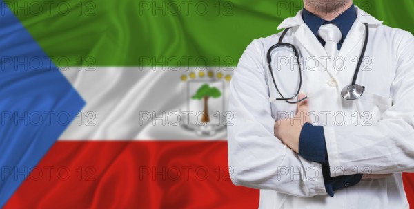 Male doctor with stethoscope on Equatorial Guinea flag. Doctor holding stethoscope on Equatorial