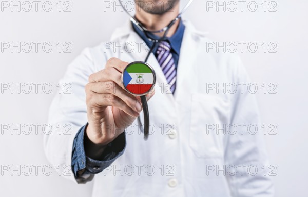 Equatorial Guinea healthcare system, doctor holding stethoscope. Equatorial Guinea health and