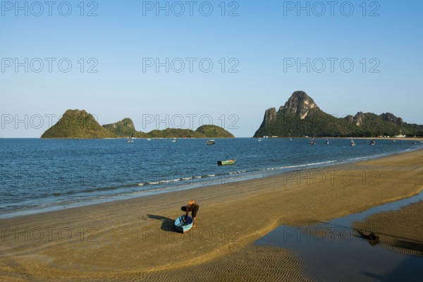 Lonely sandy beach and mountains, sunset, Prachuap Khiri Khan, Prachuap Khiri Khan Province,