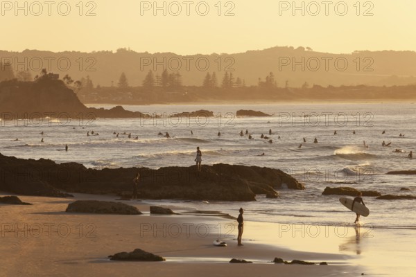 Fisherman Lookout, The Pass and surfers in the evening light of Byron Bay, New South Wales,