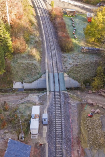 Aerial view of tracks at a railroad crossing with surrounding vegetation, Hermann Hesse Railway bat