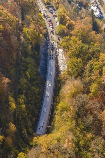Tunnel project view from the air, surrounded by diverse autumn forest and infrastructure, Hermann
