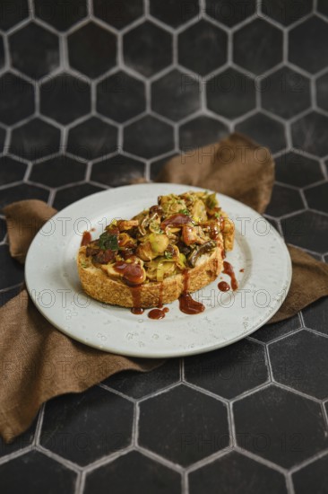 A mouthwatering mushroom sandwich topped with honey mushrooms, enoki mushrooms, and champignon