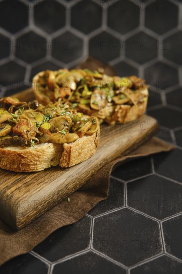 A delicious mushroom sandwich is arranged on a wooden board. The sandwich includes honey mushrooms,
