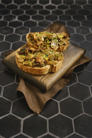 A tasty mushroom sandwiches feature fried honey mushrooms, enoki mushrooms, champignon, and leek.
