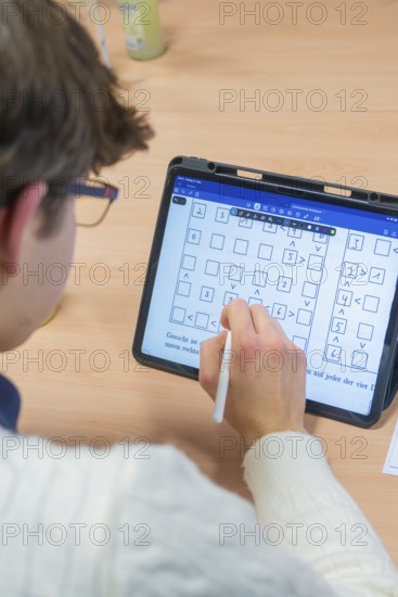 Person taking handwritten notes on a tablet, Jugend Forschungszentrum Nagold, Calw district,