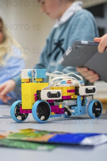 A colorful Lego robot is being assembled by children, Jugend Forschungszentrum Nagold, Calw