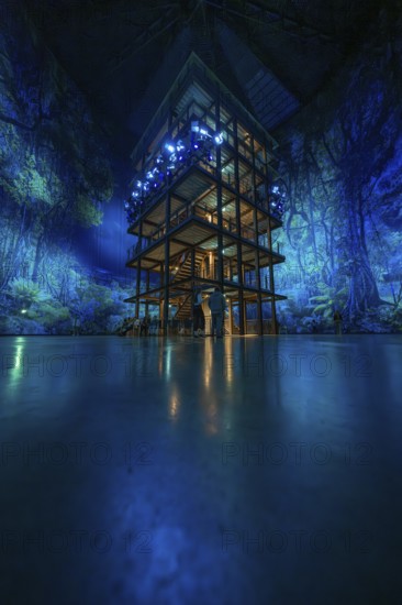 Tall structure with fascinating light installation in a blue room, Amazonia exhibition, Gasometer,