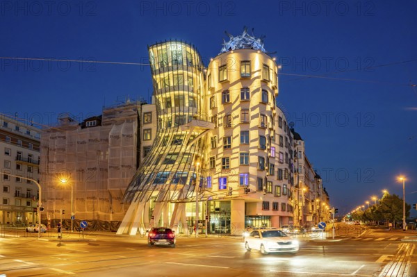 The Dancing House of architects Vlado MiluniÄ‡ and Frank Gehry at dusk, Prague, Czech Republic