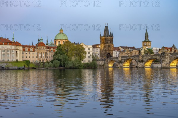 Old Town of Prague with Vltava River, Charles Bridge and Old Town Bridge Tower at dusk, Prague,