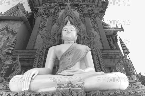 Buddha statue with tunic, Bhumispara mudra, Buddha Gautama at the moment of enlightenment, at the