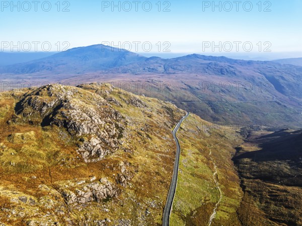 Autumn colours of Pen-y-Pass over Miner's Track, Start Point and road A4086 from a drone,