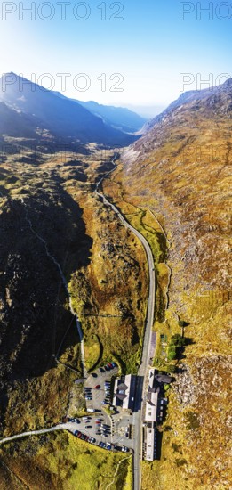 Autumn colours of Pen-y-Pass over Miner's Track, Start Point and road A4086 from a drone,