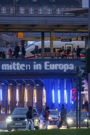 The main train station in Essen, blue illuminated underpass, bus station, am Europaplatz, ICE train