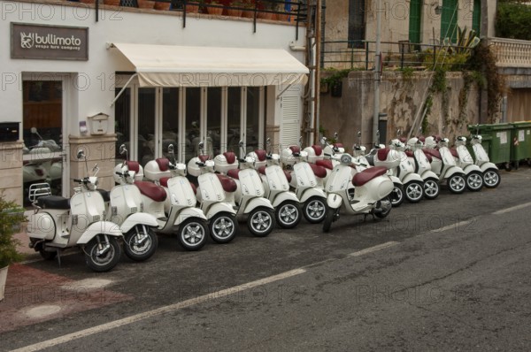 Many scooters for rent are in front of a shop, Port de Soller, Majorca, Spain