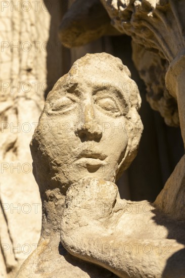 Deati lof face of carved stone figure on West Front of Exeter cathedral church, Exeter, Devon,