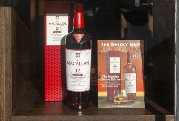 Bottle of Macallan whisky window display The Whisky Shop store, Cathedral Close, Exeter city