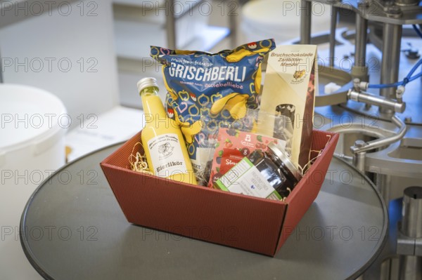 A gift basket with various delicacies such as eggnog and snacks, Christmas baking, Haselstaller