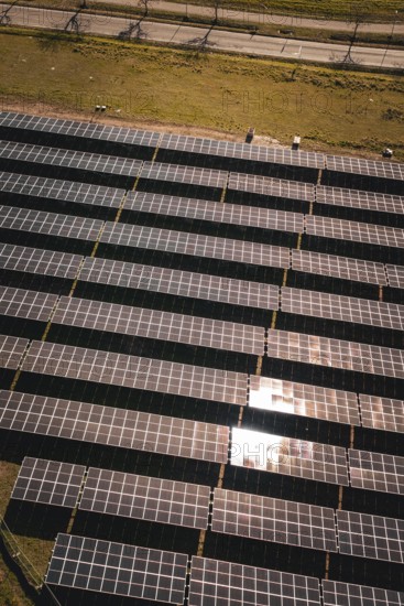 Brilliant solar modules photographed in orderly rows in the sun, PV Freifaechenanlage Bau, Weil der