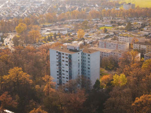 Multi-family house in autumn surroundings, surrounded by an urban silhouette, MÃ¼hlacker, Enzkreis,