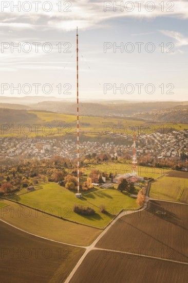 The transmission tower towers over a vast landscape with fields and villages, MÃ¼hlacker, Enzkreis,