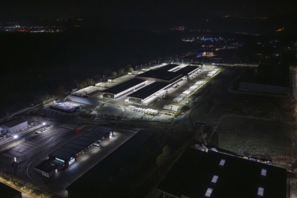 View of industrial area at night with illuminated warehouses and roads, Nagold, Calw district,