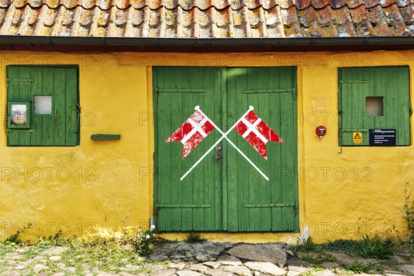 ChristiansÃ¸ Skole, smallest school in Denmark, faÃ§ade detail, characteristic yellow and green,