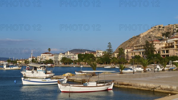 Nauplion Harbour, Palamidi Fortress, Two boats in the calm water of a picturesque coastal port,