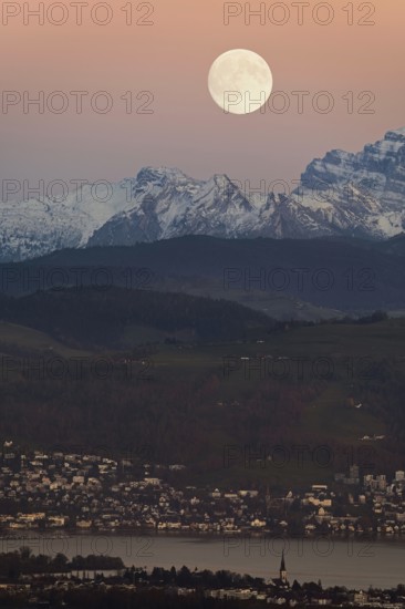 View from Horben of Lake Zug with the town of Cham and Zug, behind it the snow-capped mountains
