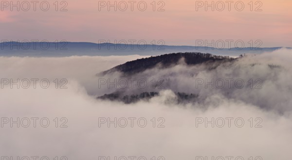 View of the Gisliflue on a Jura foothill covered in fog in the light morning light, Talheim,