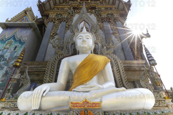 Buddha statue with tunic, Bhumispara mudra, Buddha Gautama at the moment of enlightenment, at the