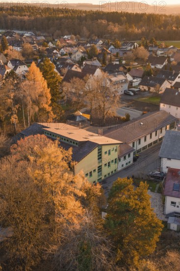 School building surrounded by autumn colors in a small village, nestled in nature, Althengstett,