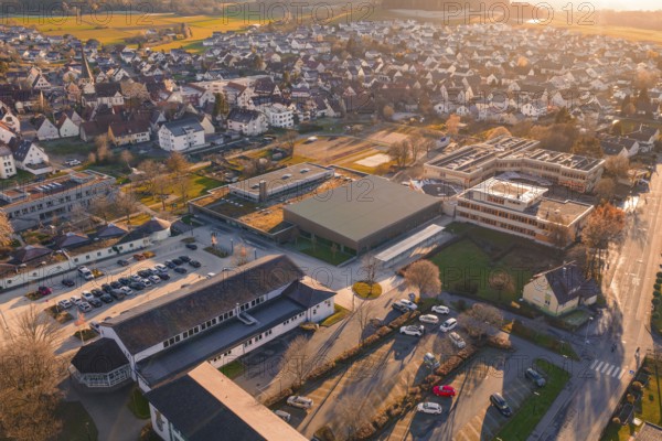 Village visible from above with sunset, roofs and surrounding landscape, Althengstett sports center