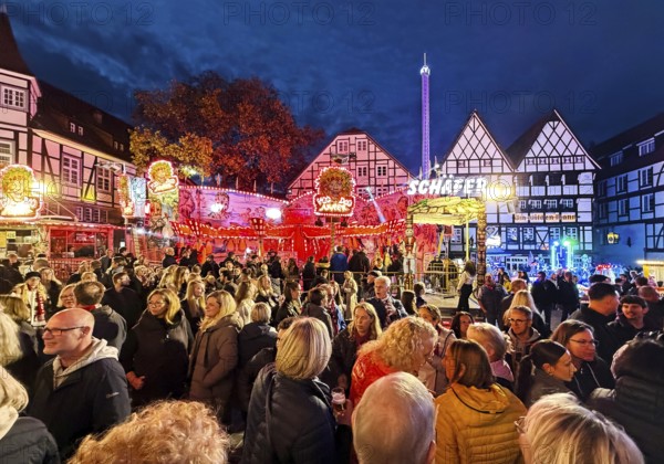 Many people at the All Saints Fair in the evening in front of half-timbered houses, Old Town,
