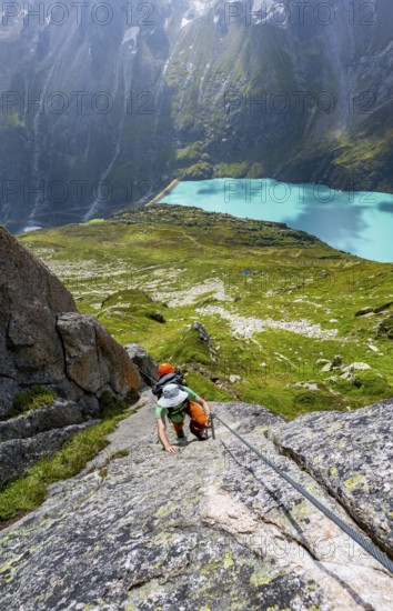 Mountaineer climbs on the secured Schijen-ZwÃ¤rg via ferrata, climb to BergseehÃ¼tte, Göscheneralp