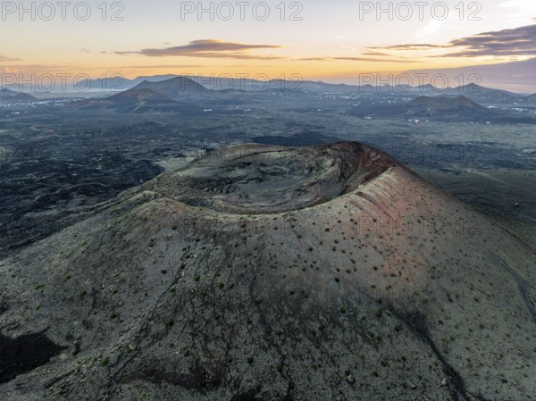 Caldera Colorada volcano, picturesque volcanic landscape with volcanic crater at sunrise, Parque